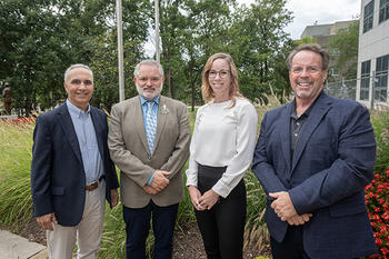 Stakeholders on the National Center on Forensics grant pose on SciTech Campus